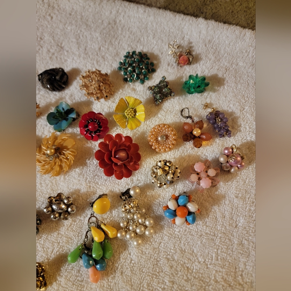 Lot of clip on earrings missing matches.